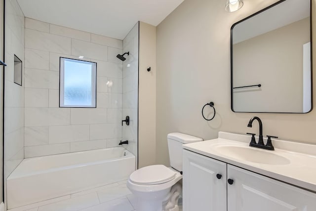 full bathroom featuring tiled shower / bath combo, vanity, and toilet