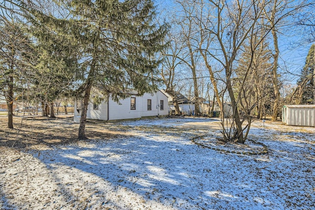 view of yard covered in snow