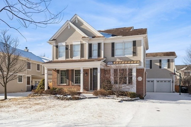 view of front of property featuring a porch and a garage