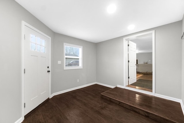 foyer featuring dark wood-type flooring