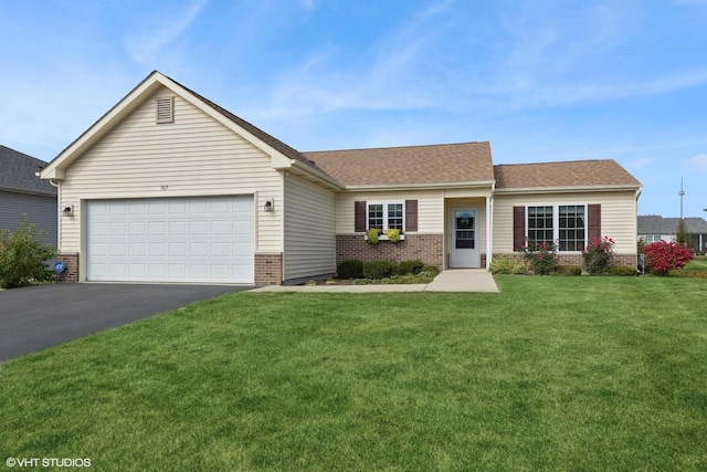 ranch-style house featuring a garage and a front lawn