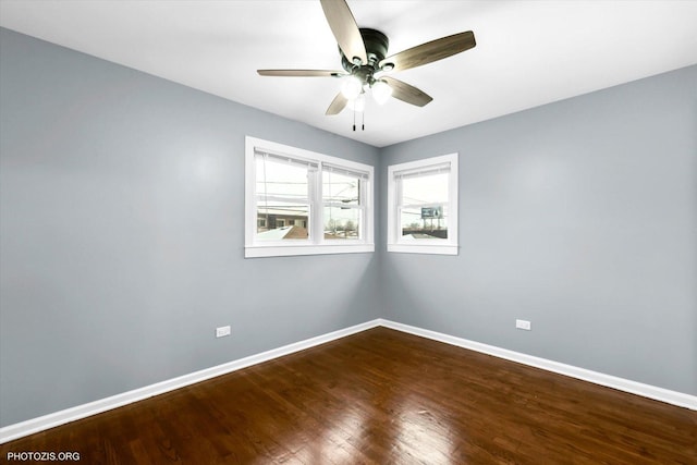 empty room with hardwood / wood-style flooring and ceiling fan