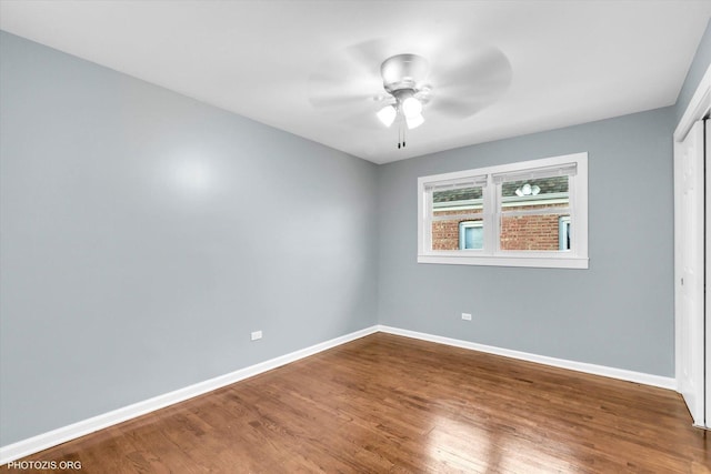 empty room featuring ceiling fan and wood-type flooring