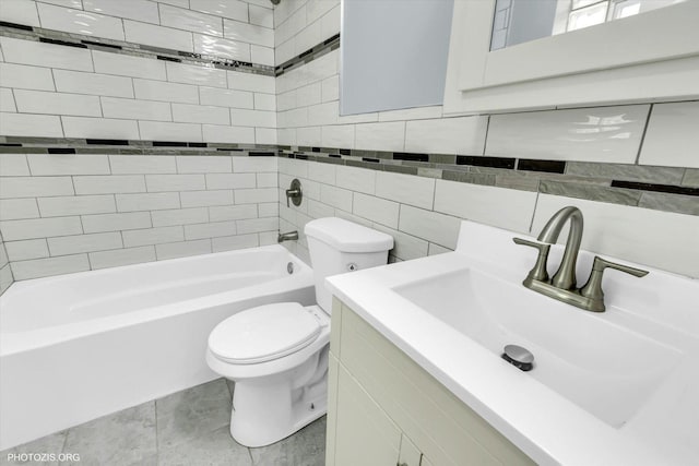 full bathroom featuring toilet, tasteful backsplash, tiled shower / bath, tile walls, and vanity