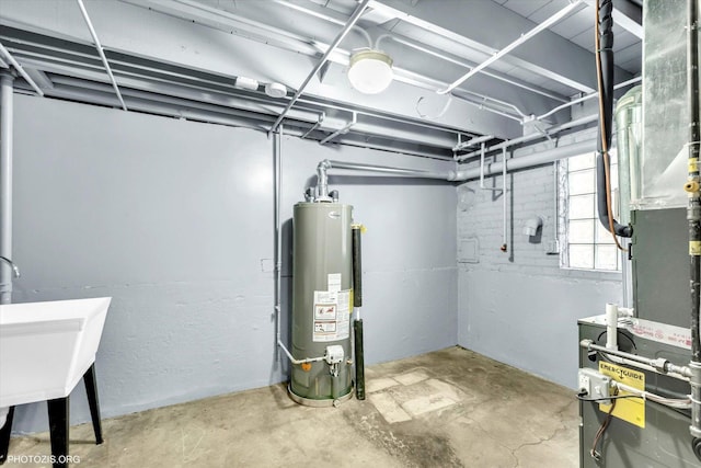 basement featuring water heater and sink