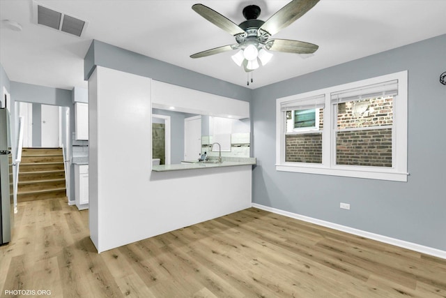 interior space featuring ceiling fan and light hardwood / wood-style flooring