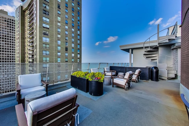 view of patio featuring a balcony and outdoor lounge area