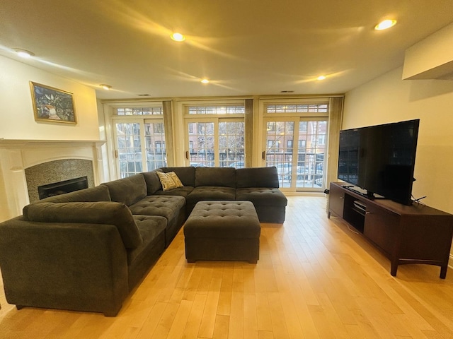 living room with light hardwood / wood-style flooring