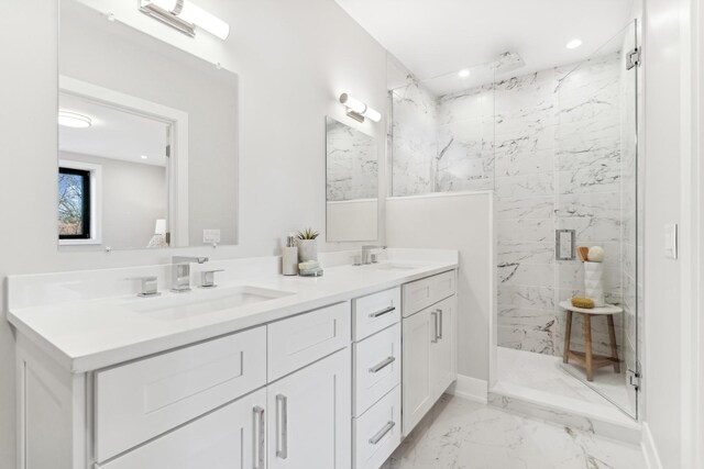 bedroom featuring sink, ensuite bath, and light hardwood / wood-style flooring