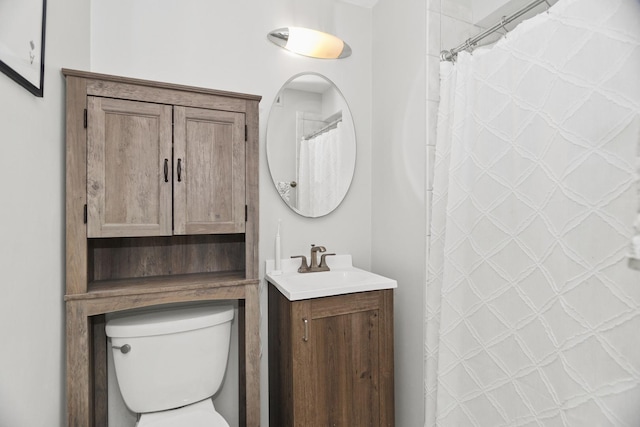 bathroom featuring vanity, a shower with curtain, and toilet