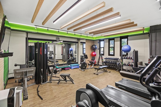 gym with light hardwood / wood-style floors