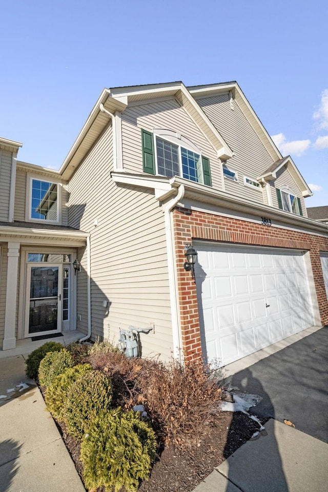 view of side of home featuring a garage