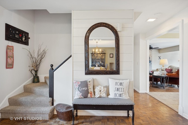 interior space with parquet flooring and a notable chandelier