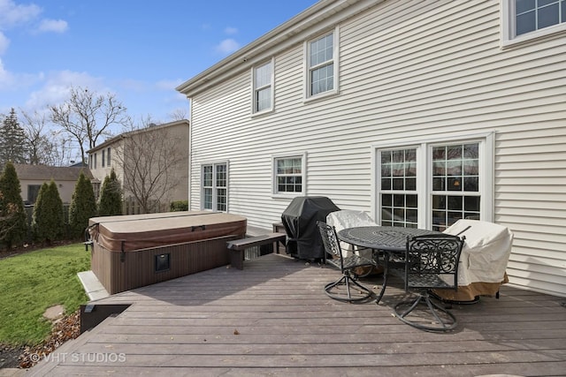 deck featuring area for grilling and a hot tub