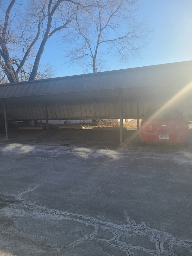 view of vehicle parking featuring a carport