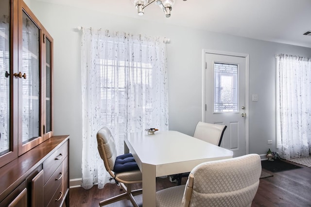 dining area featuring dark hardwood / wood-style flooring