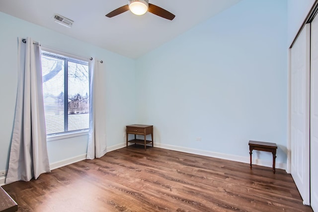 empty room featuring dark hardwood / wood-style floors and ceiling fan