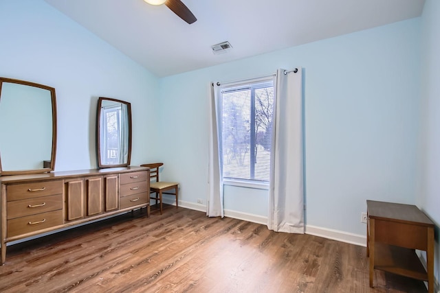 bedroom featuring lofted ceiling, dark wood-type flooring, and ceiling fan