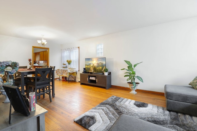 living room featuring hardwood / wood-style flooring and a chandelier