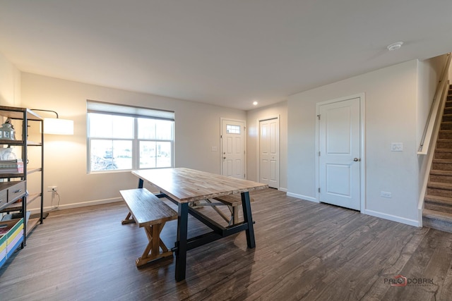 dining space featuring dark wood-type flooring