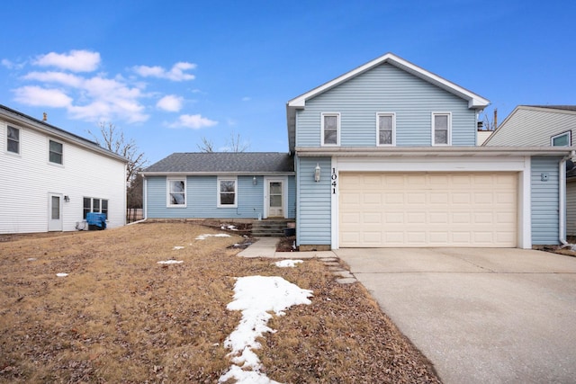 view of front of home featuring a garage and driveway