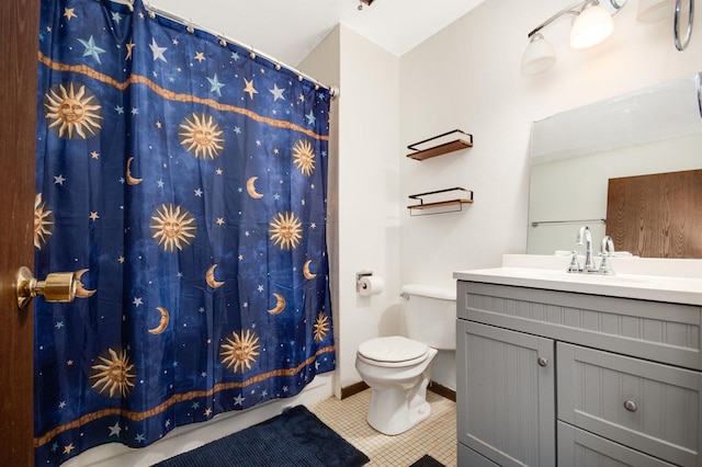 full bathroom with tile patterned flooring, curtained shower, vanity, and toilet