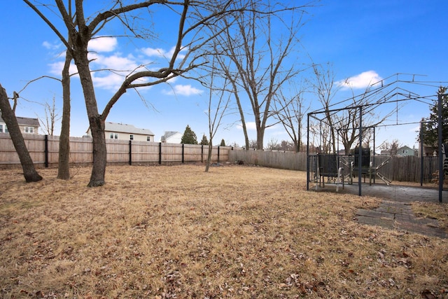 view of yard with a fenced backyard