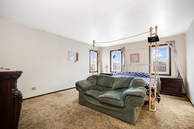 carpeted bedroom with baseboards