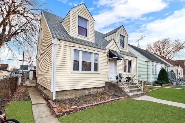 new england style home with a front yard