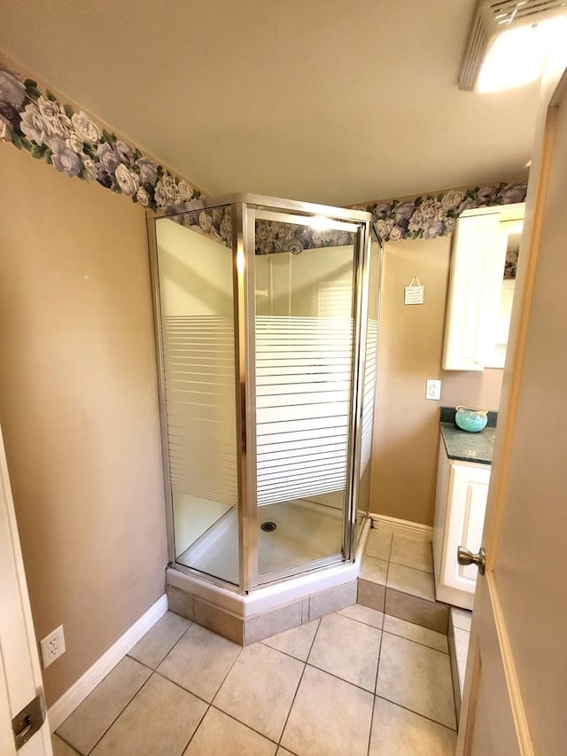 bathroom with tile patterned flooring and walk in shower