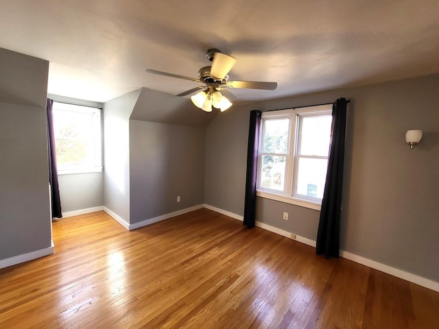 bonus room featuring vaulted ceiling, ceiling fan, and light hardwood / wood-style floors