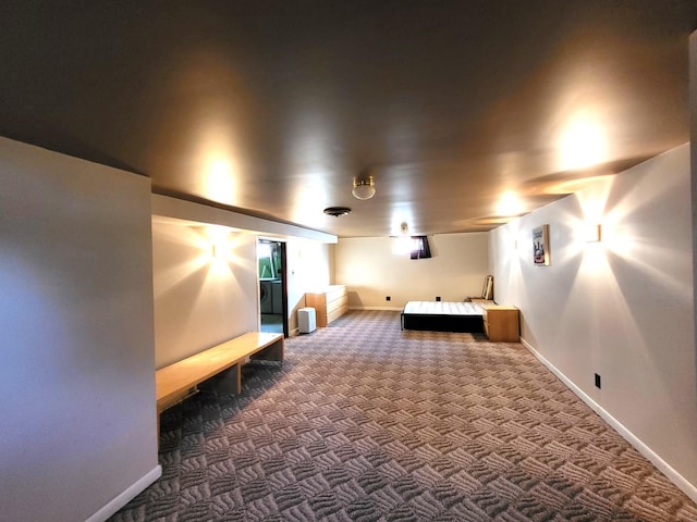 home theater room featuring dark colored carpet