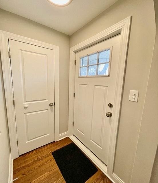 entryway with hardwood / wood-style floors