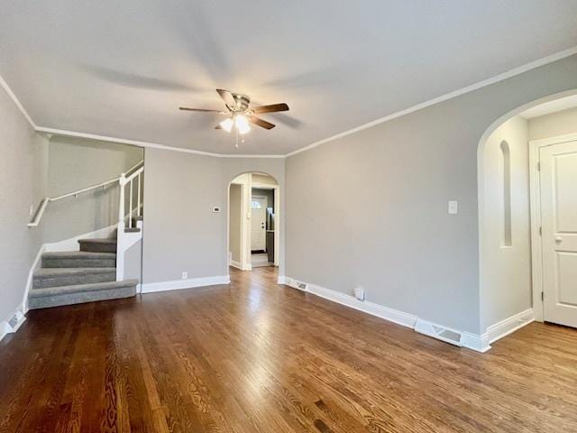 unfurnished living room with hardwood / wood-style flooring, ornamental molding, and ceiling fan