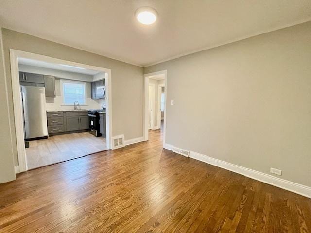 interior space featuring hardwood / wood-style flooring and sink