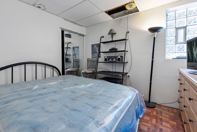 bedroom featuring a paneled ceiling