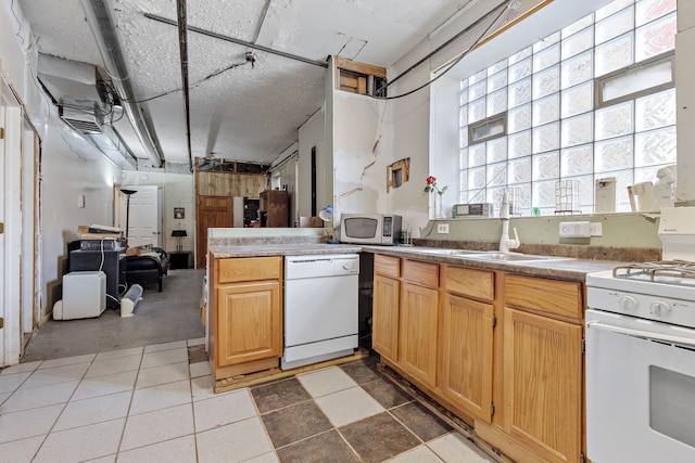 kitchen with white appliances and a peninsula