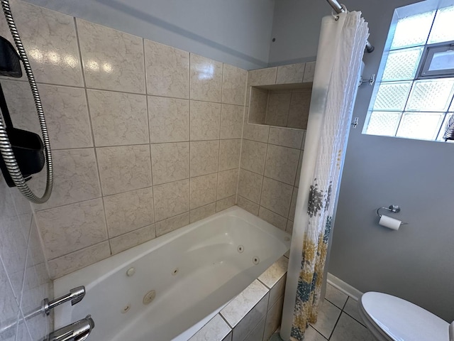 bathroom with shower / tub combo, tile patterned flooring, and toilet