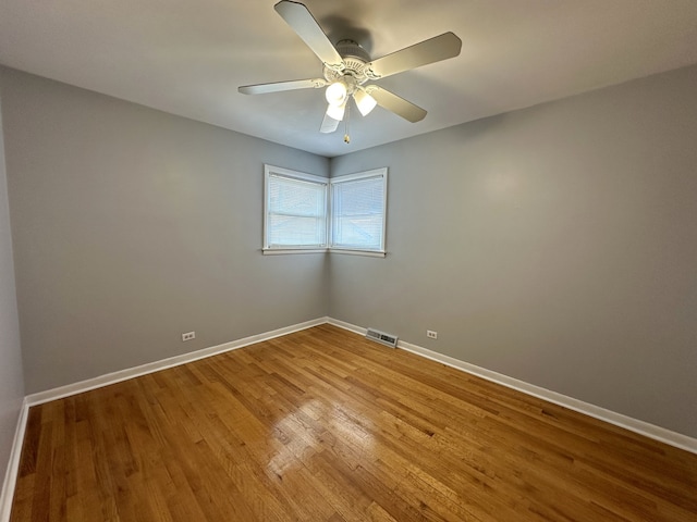 spare room featuring ceiling fan and light hardwood / wood-style flooring