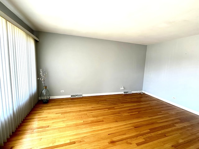 unfurnished room featuring light wood-type flooring