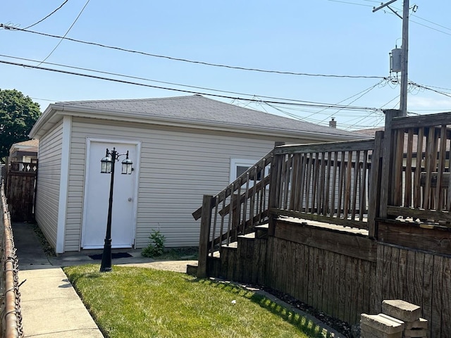 exterior space featuring a wooden deck and a yard