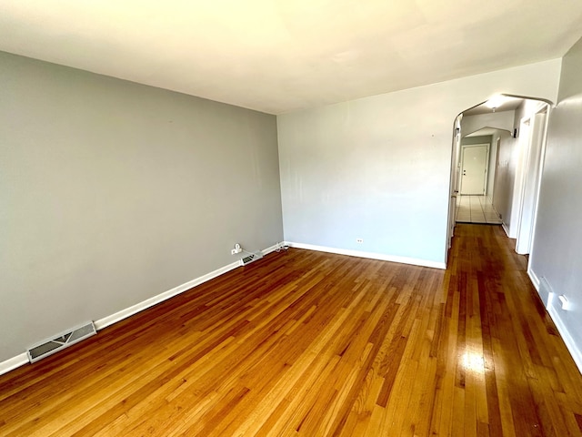 empty room featuring hardwood / wood-style flooring