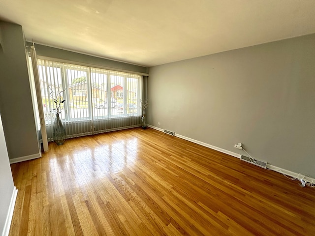 spare room featuring hardwood / wood-style flooring