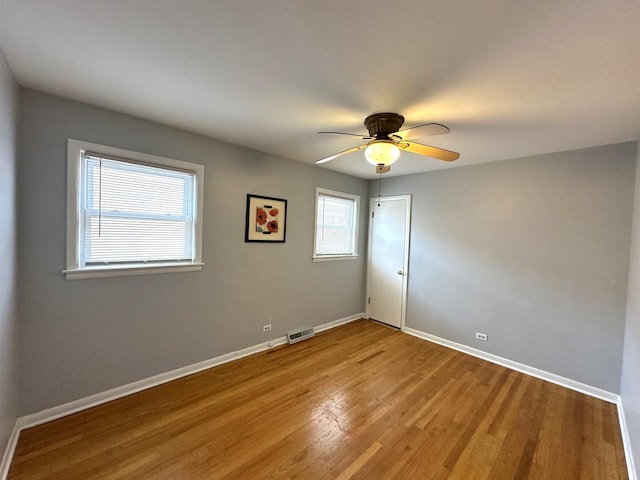 unfurnished room with ceiling fan and light hardwood / wood-style flooring