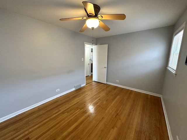 unfurnished room featuring wood-type flooring and ceiling fan