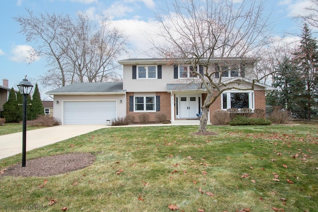 view of front of home with a garage and a front yard