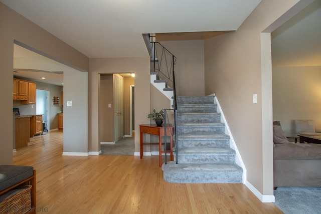 stairway with wood-type flooring