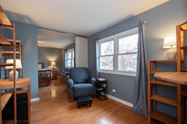 sitting room with light hardwood / wood-style flooring