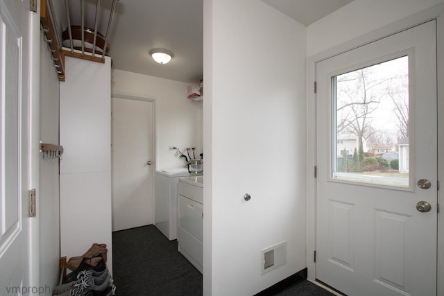 entryway with separate washer and dryer