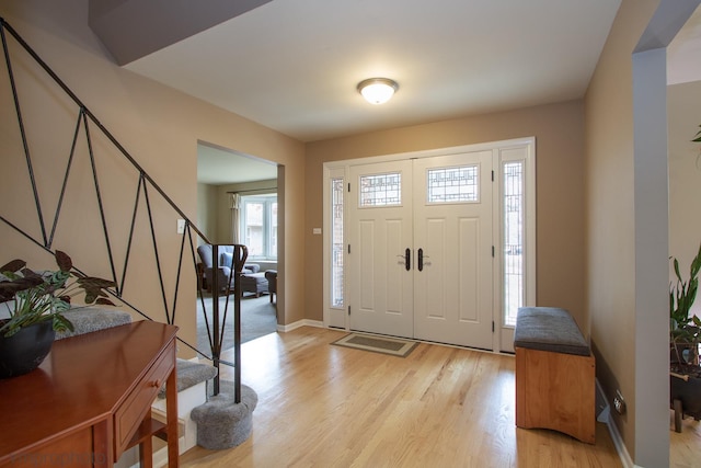 foyer with light hardwood / wood-style floors